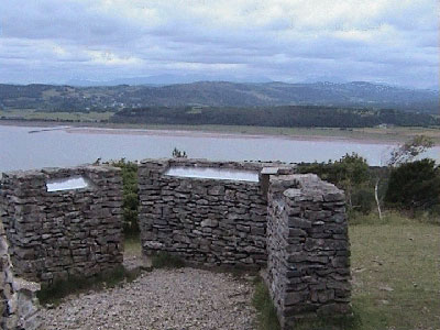 The three stone columns each with an inlaid Lakeland hills pictorial