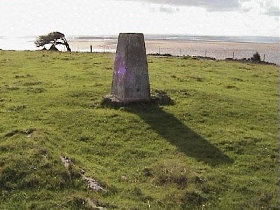 Triangulation point on Humphrey Head with the sands behind