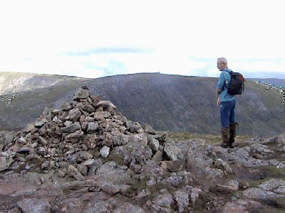 Cairn at Stony Cove Pike with Thornthwaite Crag and High Street behind