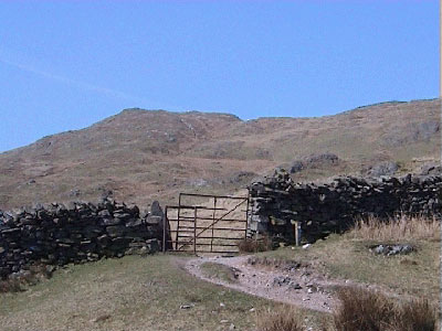 View through the kissing gate to the summit of Wansfell